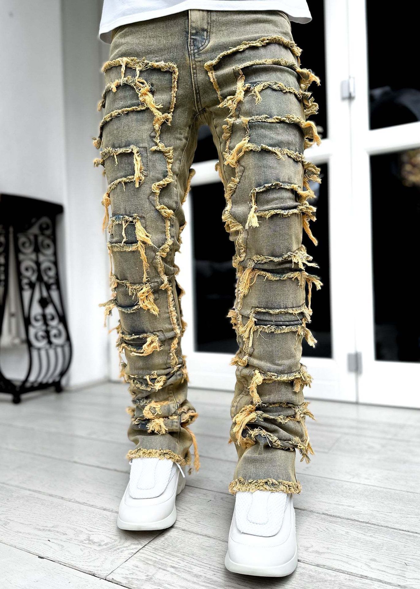 Urban Fracture slim stacked pants featuring modern patchwork look  